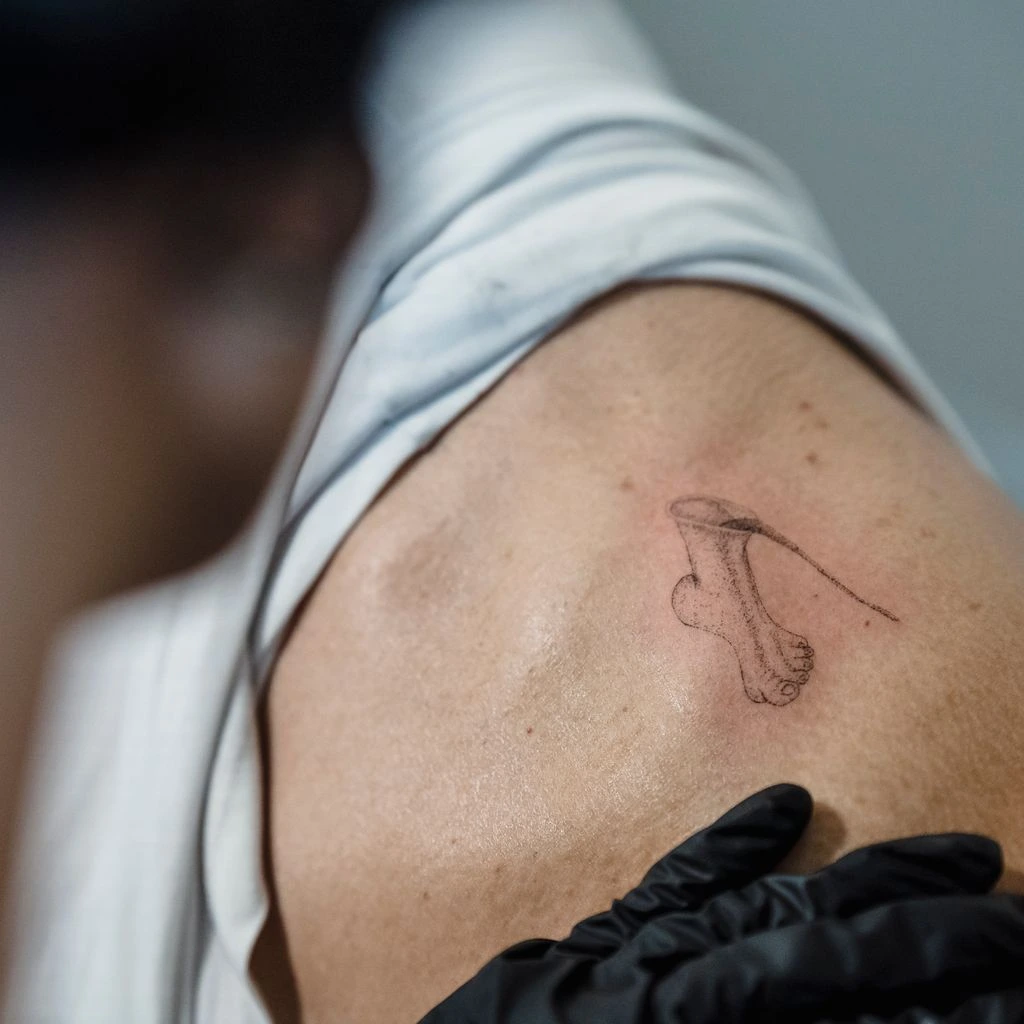 Minimalist single-needle wrist tattoo, featured this week
