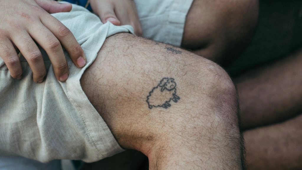 Fine line collarbone tattoo
